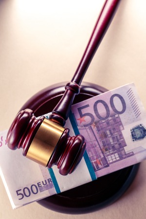 Wooden judge's gavel and euro in toningの写真素材