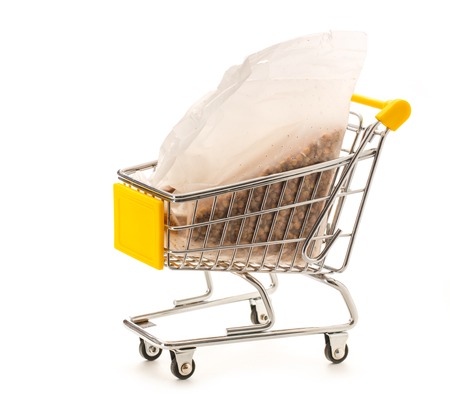 Packet of dry buckwheat in small supermarket pushcart closeupの写真素材
