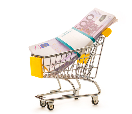 Pack of euro banknotes in supermarket pushcartの写真素材