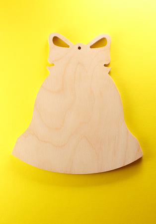 Blank wooden cutting board in bell formの写真素材
