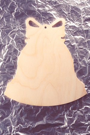 Blank wooden cutting board in bell formの写真素材