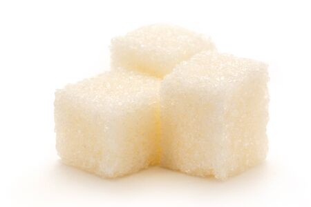 Cubes of sugar on the white backgroundの写真素材