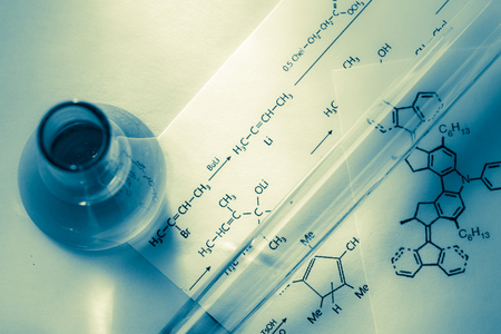 Chemical tubes with reaction formula in lightの写真素材