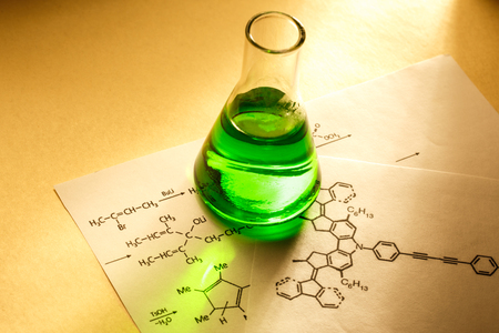 Chemical tube with reaction formula in lightの写真素材