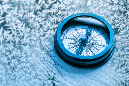 Vintage metal compass in toning light closeupの写真素材