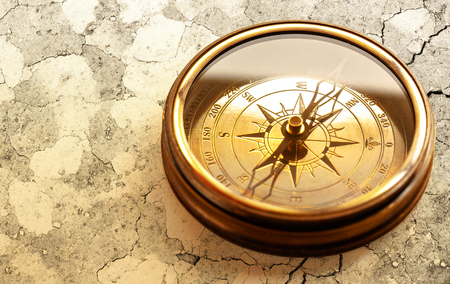 Vintage metal compass in toning light closeupの写真素材