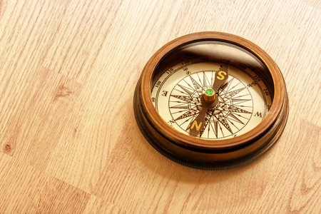 Vintage metal compass in toning light closeupの写真素材