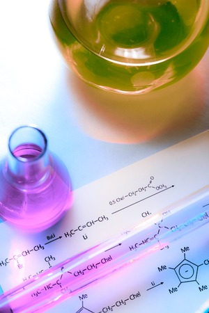Chemical tubes with reaction formula in lightの写真素材