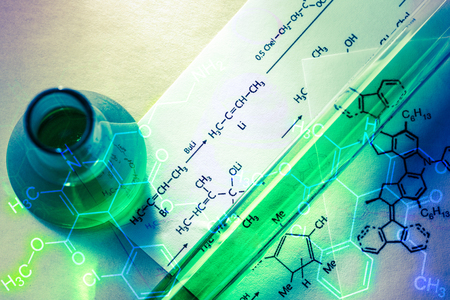Chemical tube with reaction formula in lightの写真素材
