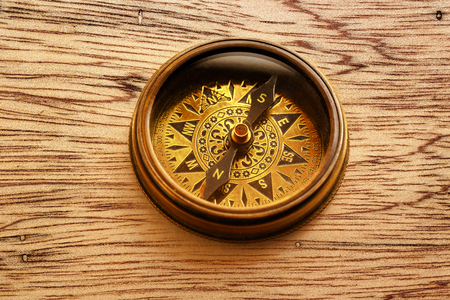 Vintage metal compass in toning light closeupの写真素材