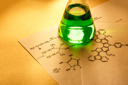 Chemical tube with reaction formula in lightの写真素材