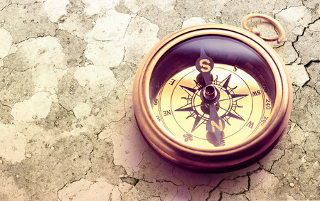 Vintage metal compass in toning light closeupの写真素材