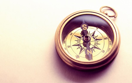 Vintage metal compass in toning light closeupの写真素材