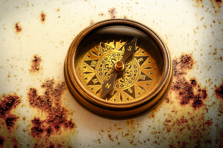 Vintage metal compass in toning light closeupの写真素材