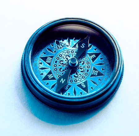 Vintage metal compass in toning light closeupの写真素材
