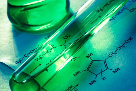 Chemical tubes with reaction formula in lightの写真素材