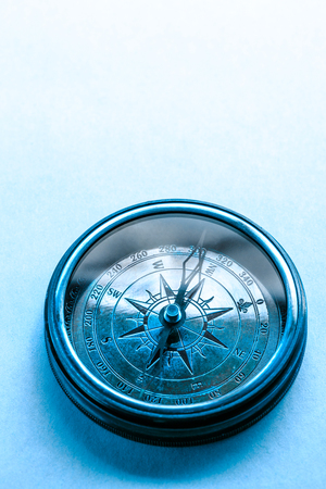 Vintage metal compass in toning light closeupの写真素材