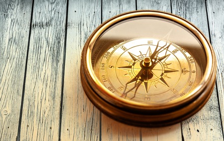 Vintage metal compass in toning light closeupの写真素材