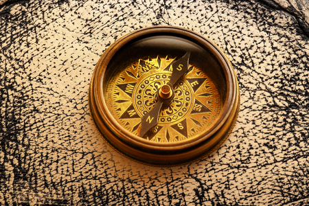 Vintage metal compass in toning light closeupの写真素材
