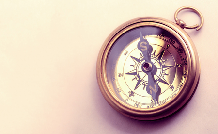 Vintage metal compass in toning light closeupの写真素材