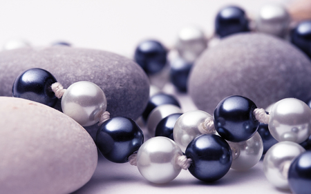 String of black and white pearls with stonesの写真素材