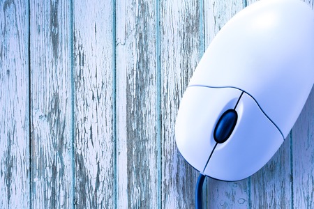 Computer mouse in the blue toning closeupの写真素材