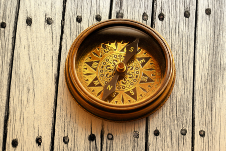 Vintage metal compass in toning light closeupの写真素材
