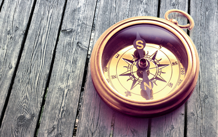 Vintage metal compass in toning light closeupの写真素材