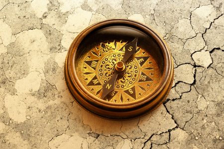 Vintage metal compass in toning light closeupの写真素材