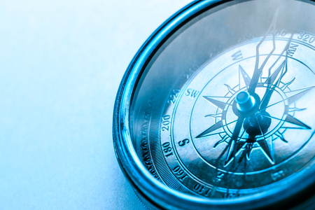 Vintage metal compass in toning light closeupの写真素材