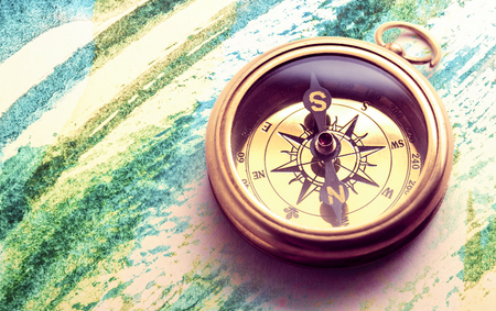 Vintage metal compass in toning light closeupの写真素材