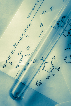 Chemical tube with reaction formula in lightの写真素材