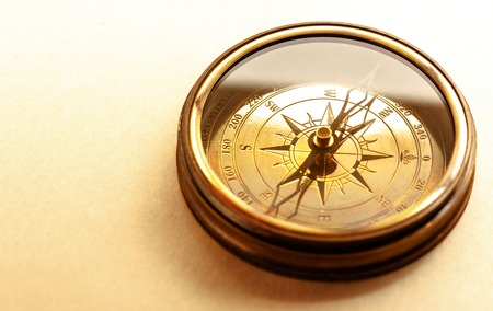 Vintage metal compass in toning light closeupの写真素材