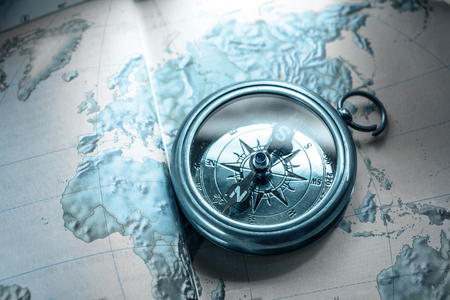Compass on map background in blue toningの写真素材