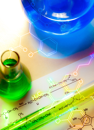 Chemical tube with reaction formula in lightの写真素材