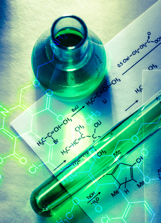 Chemical tube with reaction formula in lightの写真素材