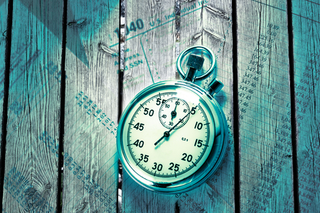 Tax form, operating budget and stopwatch in closeupの写真素材