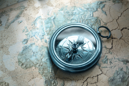 Compass on map background in blue toningの写真素材