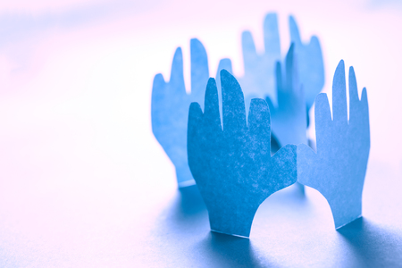 Paper hands in connection as friendship symbolの写真素材