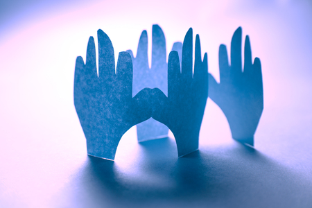 Paper hands in connection as friendship symbolの写真素材