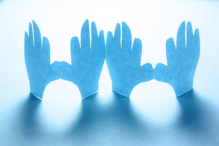Paper hands in connection as friendship symbolの写真素材