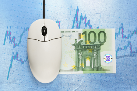 Candle stick graph chart, mouse and eurosの写真素材