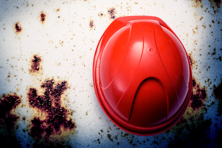 Red safety helmet from the top on metal backgroundの写真素材