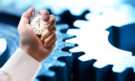 Mechanical ratchets and stopwatch in male handの写真素材