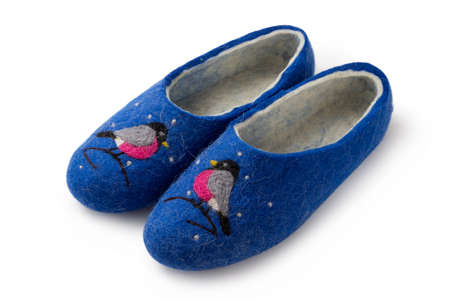 Felt slippers on white background in closeupの写真素材