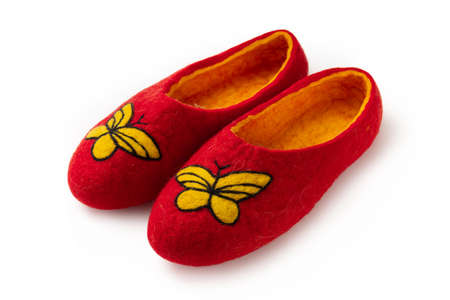 Felt slippers on white background in closeupの写真素材