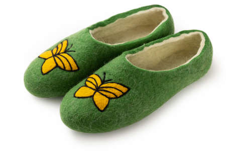 Felt slippers on white background in closeupの写真素材
