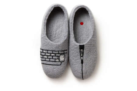 Felt slippers on white background in closeupの写真素材