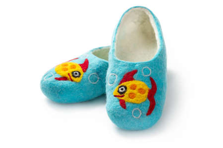 Felt slippers on white background in closeupの写真素材
