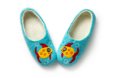 Felt slippers on white background in closeupの写真素材